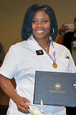 Nurse holding her diploma