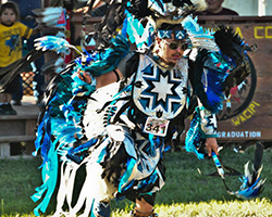 Pinoleville Pomo Nation dancer in traditional clothing