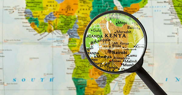 Magnifying glass over a map of Kenya