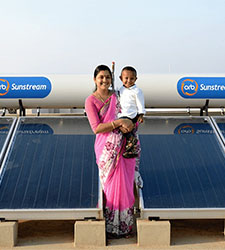 Woman and child with solar panels on roof