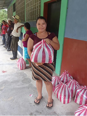 Woman holding a food basket in Honduras
